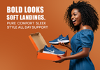Woman holding box of Nike shoes
