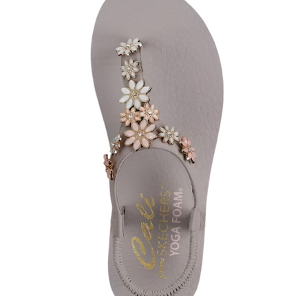 Full shot of Skechers Cali Meditation Happy Daisies Sandals on a travel adventure