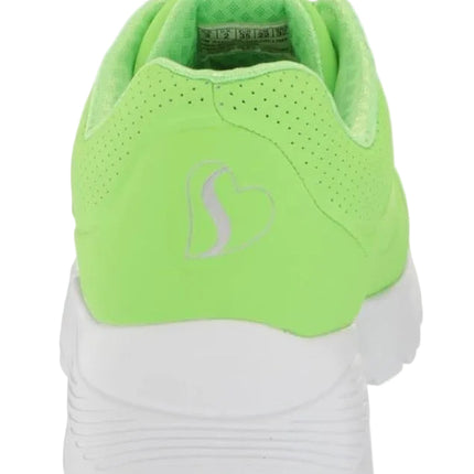 Green athletic shoe with a white sole on a white background