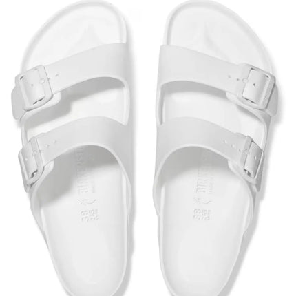 top-down view of birkenstock pool sandals in EVA material styled for Florida beach lifestyle