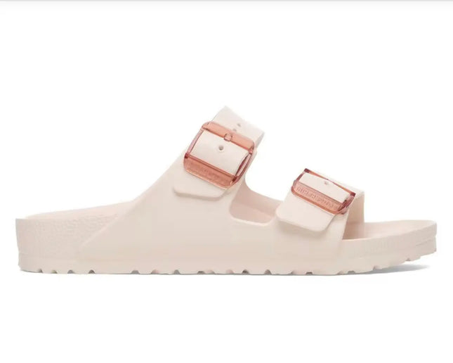 Birkenstock big buckle close-up showing polished hardware and flexible pink strap design

