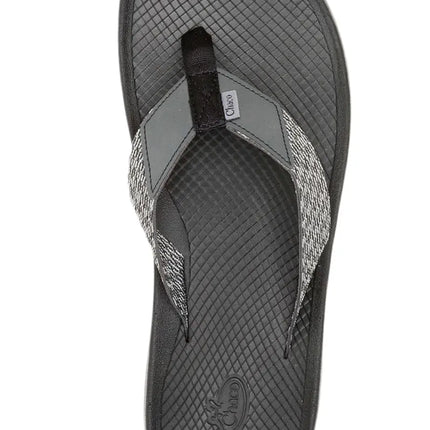pair of chaco women's lowdown flip flops on wooden dock with water droplets

