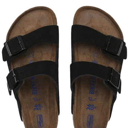 Person walking in Birkenstock Arizona suede sandals