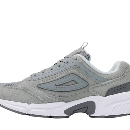 fila casual sneakers resting on concrete ledge with street-style backdrop