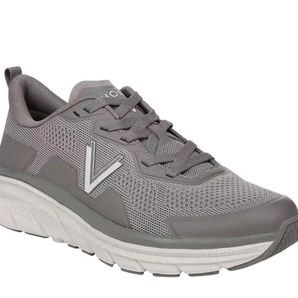 The VIONIC WALK MAX KNIT men’s sneakers feature a gray mesh upper, lace-up closure, supportive cushioned sole, arch support, and a bold white V logo—perfect for anyone seeking comfortable knit athletic footwear.