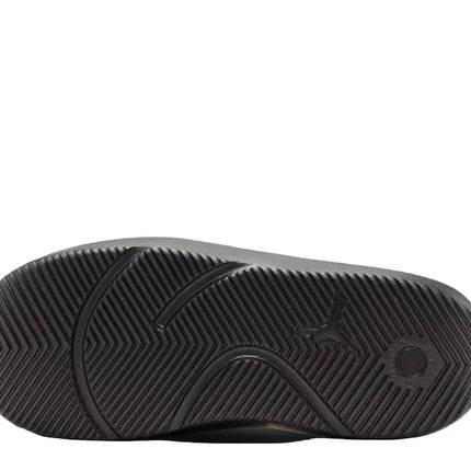 The image displays the bottom sole of the NIKE FRANCHISE SLIDE by NIKE, featuring a black textured zigzag tread pattern and a small circular design near the heel for enhanced support.