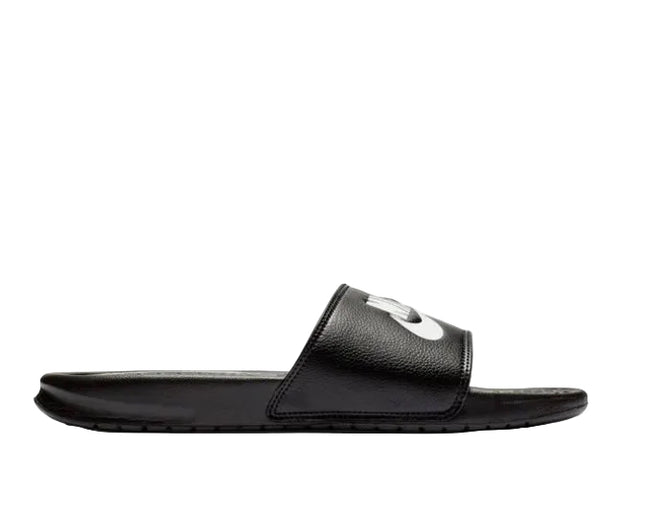 The NIKE BENASSI JDI SLIDE by NIKE is shown in black with a wide strap and white Nike logo, displayed in side profile on a white background. It features a soft foam midsole for lightweight, all-day comfort.
