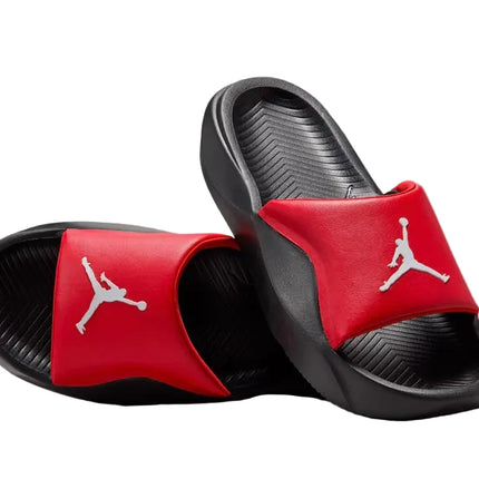 The Nike Franchise Slide features black and red styling with a white Nike logo on the red strap, delivering a secure fit and casual comfort.