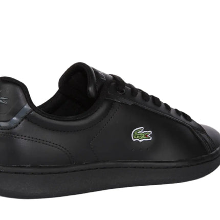 lacoste carnaby trainers placed beside weekend travel gear and sunglasses