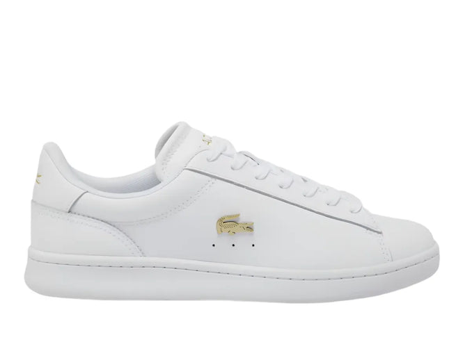 lacoste carnaby pro leather sneakers in white photographed on Orlando café patio floor