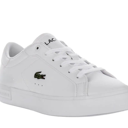 lacoste powercourt leather sneakers styled with cuffed chinos in city setting