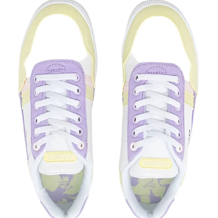 lacoste t clip shoes styled casually with cuffed chinos and sunglasses