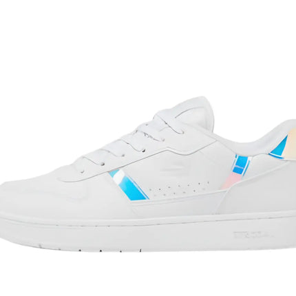 side view of lacoste t clip leather sneakers resting on pavement under palm trees