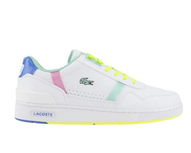 lacoste t clip sneakers styled with casual joggers and graphic tee near city mural