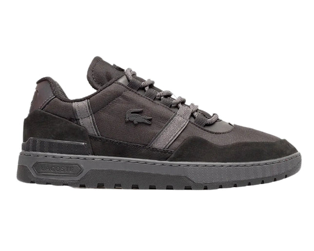lacoste t clip winter 222 black sneakers styled with tapered pants in downtown Orlando, FL