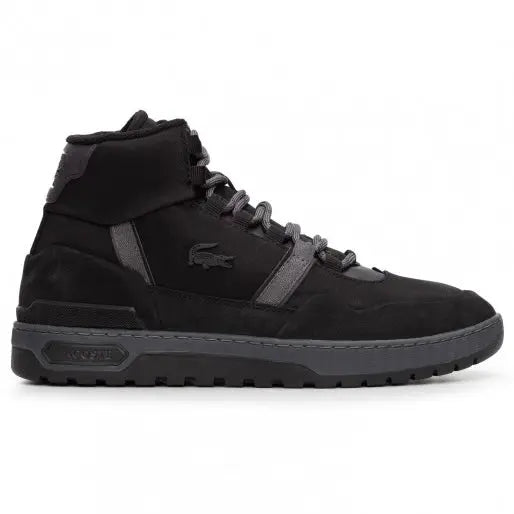 lacoste t clip winter mid sneakers styled with black denim in downtown Orlando, FL