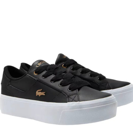 side view of lacoste ziane black sneakers resting on Tampa’s modern outdoor cafe steps