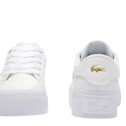 ziane chunky white leather sneakers placed on poolside deck in Fort Lauderdale, FL