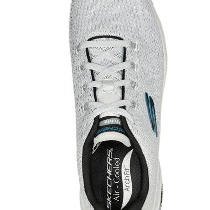 Full view of Skechers Arch Fit-Takar sneakers on the go

